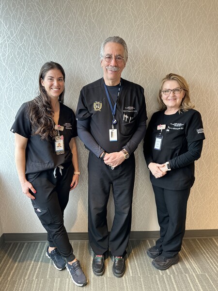 Dr. Douglas with 2 assistants