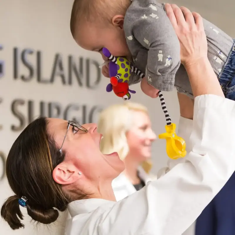 dr ratoulo with a baby patient
