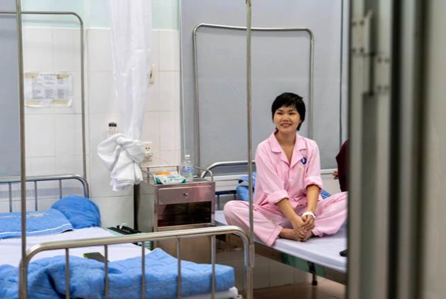 Resurge International patient sitting in a hospital bed