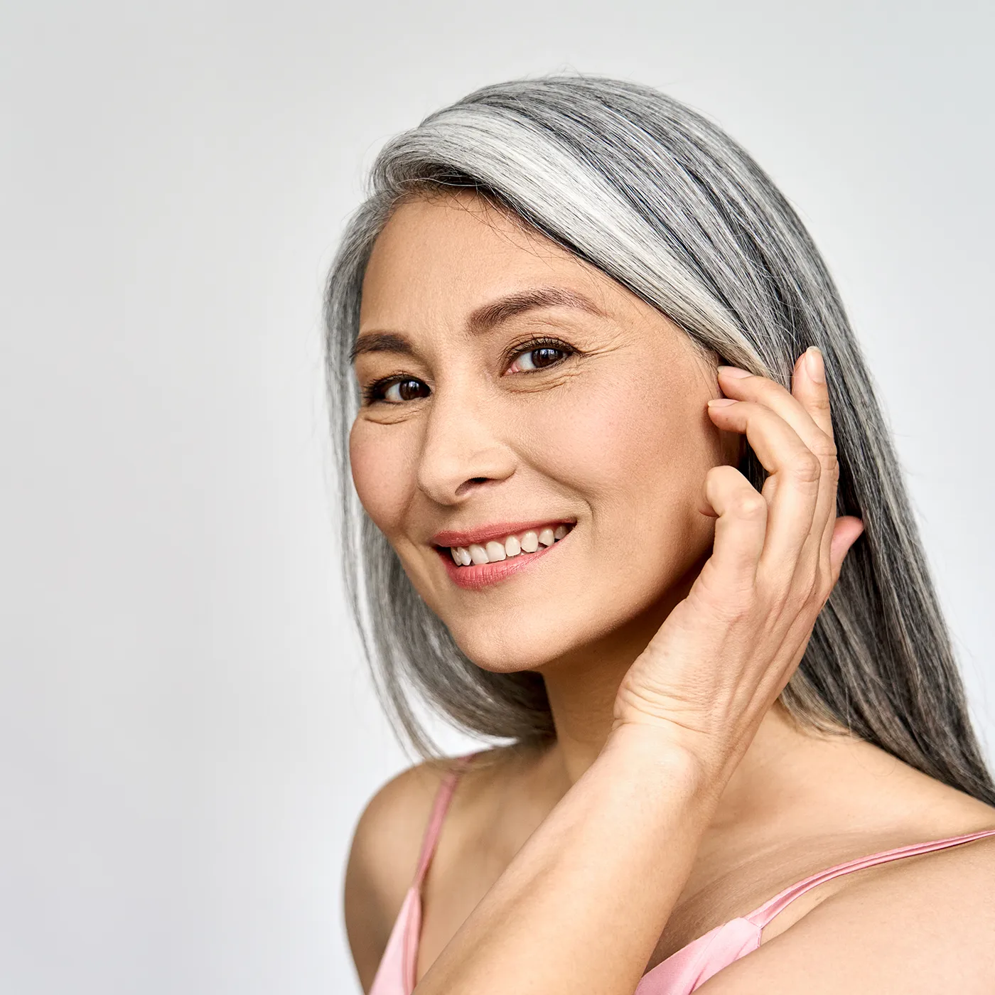 asian woman in her 40s smiling