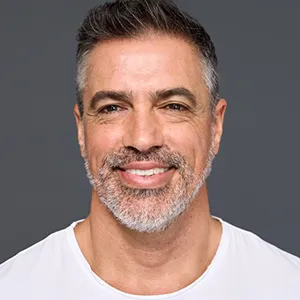 middle aged man smiling towards the camera