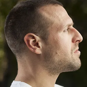 side profile of a mans face with a large nose