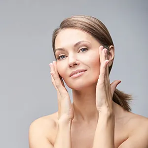 woman toucher her face