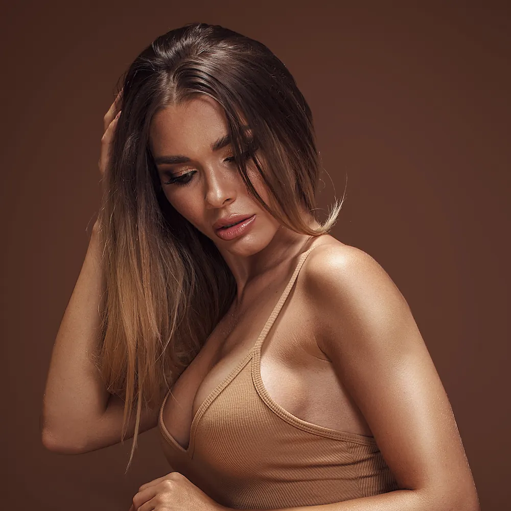 Woman posing after breast augmentation surgery